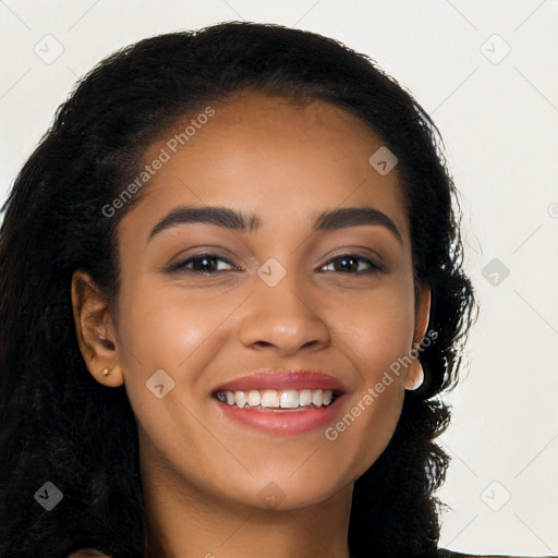 Joyful latino young-adult female with long  black hair and brown eyes