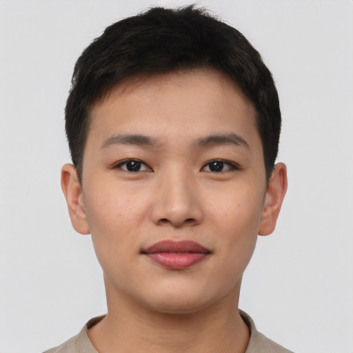 Joyful asian young-adult male with short  brown hair and brown eyes