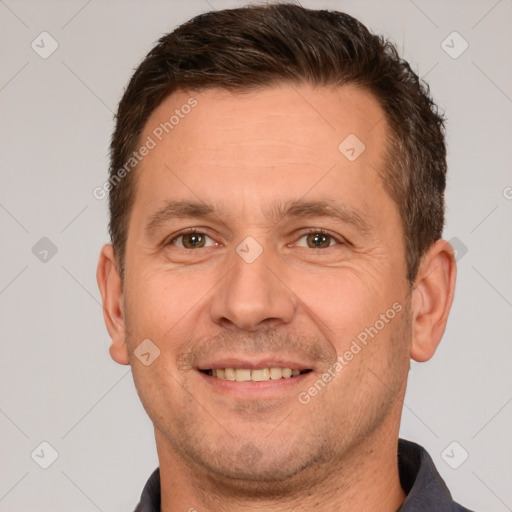 Joyful white adult male with short  brown hair and brown eyes