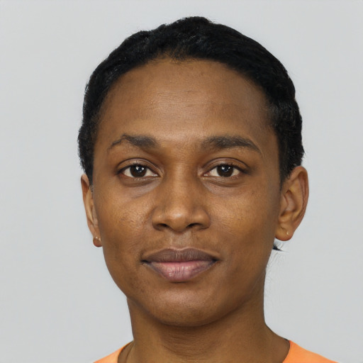 Joyful black young-adult female with short  black hair and brown eyes