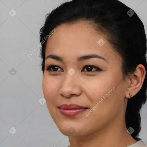 Joyful asian young-adult female with medium  brown hair and brown eyes