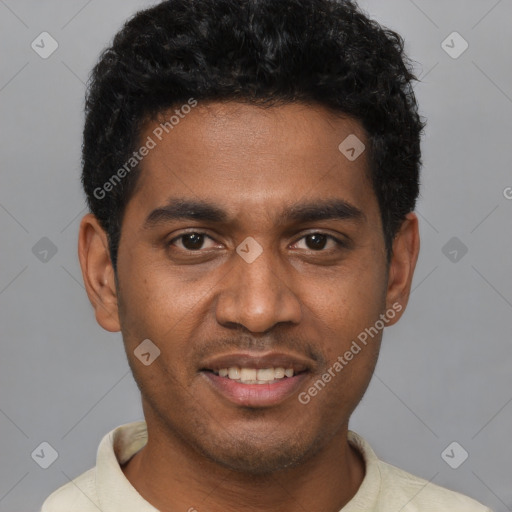 Joyful black young-adult male with short  black hair and brown eyes