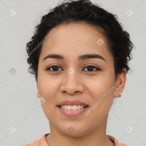 Joyful latino young-adult female with short  brown hair and brown eyes