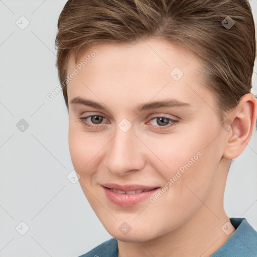 Joyful white young-adult female with short  brown hair and grey eyes