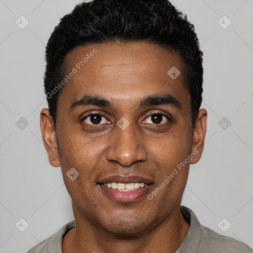 Joyful black young-adult male with short  black hair and brown eyes