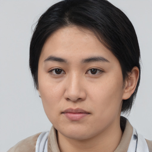 Neutral asian young-adult female with medium  brown hair and brown eyes