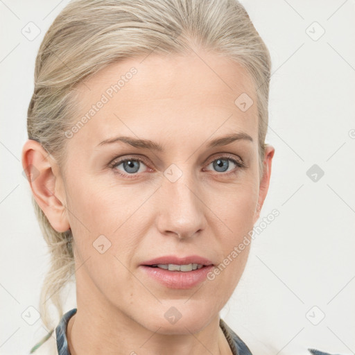 Joyful white adult female with medium  brown hair and blue eyes