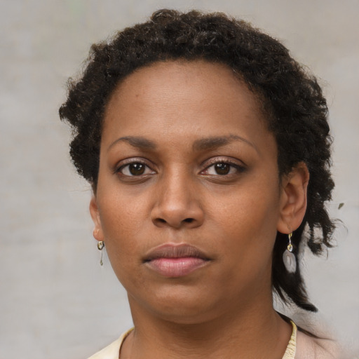 Neutral black young-adult female with short  brown hair and brown eyes