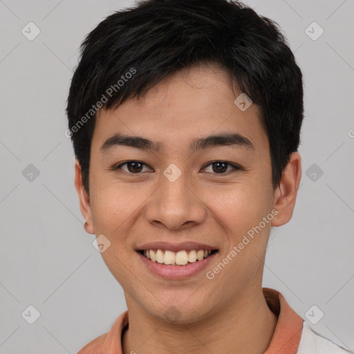 Joyful asian young-adult male with short  black hair and brown eyes