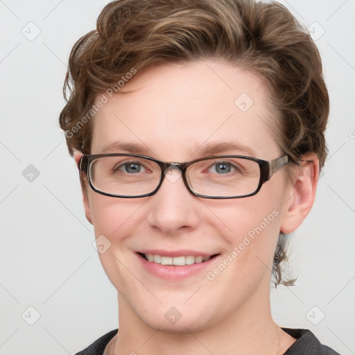 Joyful white young-adult female with short  brown hair and blue eyes