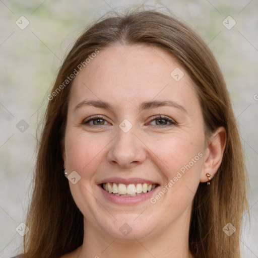 Joyful white adult female with long  brown hair and grey eyes