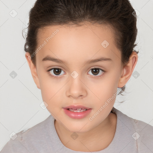 Joyful white child female with short  brown hair and brown eyes