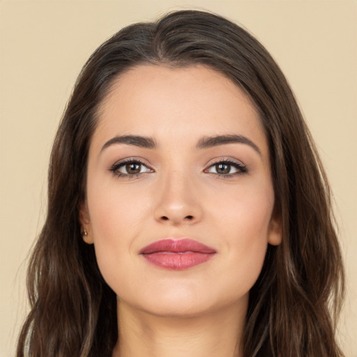 Joyful white young-adult female with long  brown hair and brown eyes