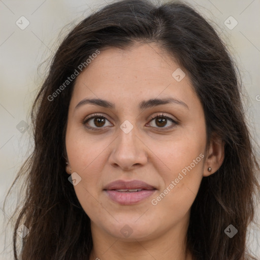 Joyful white adult female with long  brown hair and brown eyes