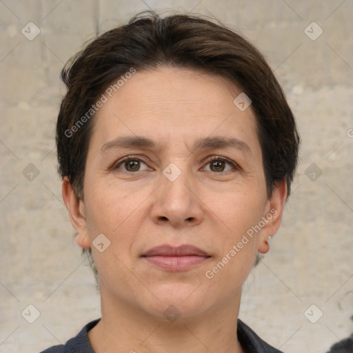 Joyful white adult female with short  brown hair and brown eyes