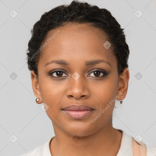 Joyful black young-adult female with short  black hair and brown eyes