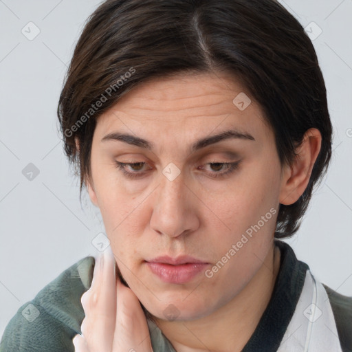 Joyful white adult female with medium  brown hair and brown eyes