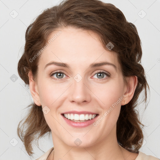 Joyful white young-adult female with medium  brown hair and green eyes