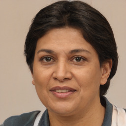 Joyful white adult female with medium  brown hair and brown eyes