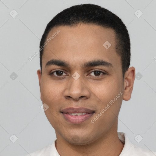 Joyful latino young-adult male with short  black hair and brown eyes