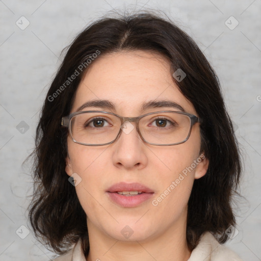 Joyful white adult female with medium  brown hair and brown eyes