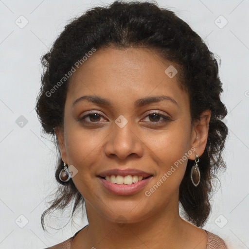 Joyful black young-adult female with long  brown hair and brown eyes