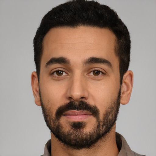 Neutral latino young-adult male with short  black hair and brown eyes