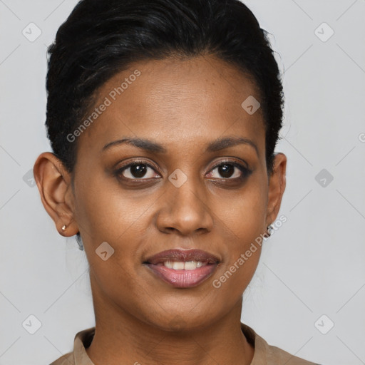 Joyful black young-adult female with short  brown hair and brown eyes