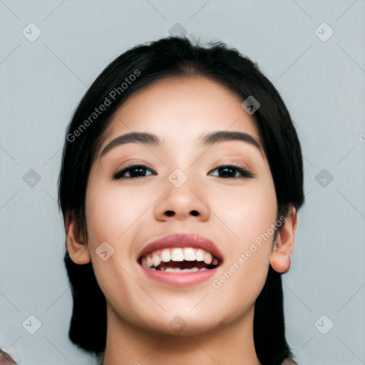 Joyful asian young-adult female with long  black hair and brown eyes