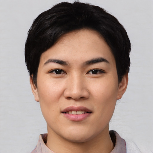Joyful asian young-adult female with short  black hair and brown eyes