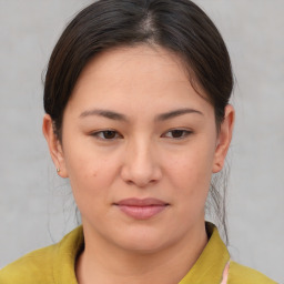 Joyful asian young-adult female with short  brown hair and brown eyes