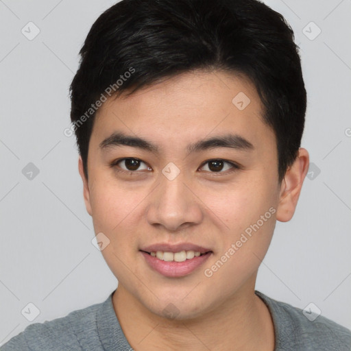 Joyful asian young-adult male with short  brown hair and brown eyes