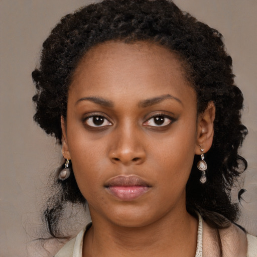 Neutral black young-adult female with long  black hair and brown eyes