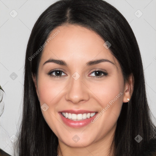 Joyful white young-adult female with long  black hair and brown eyes