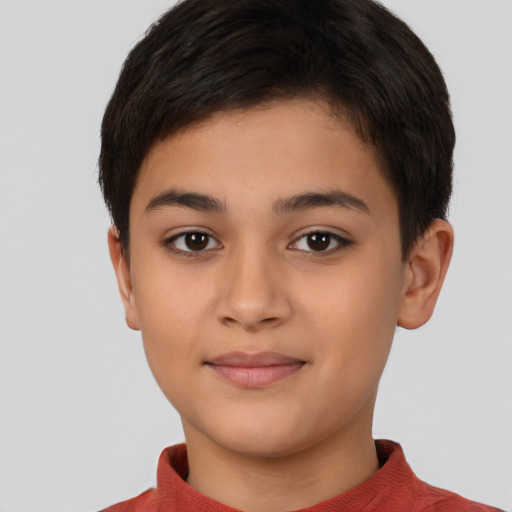 Joyful latino child female with short  brown hair and brown eyes