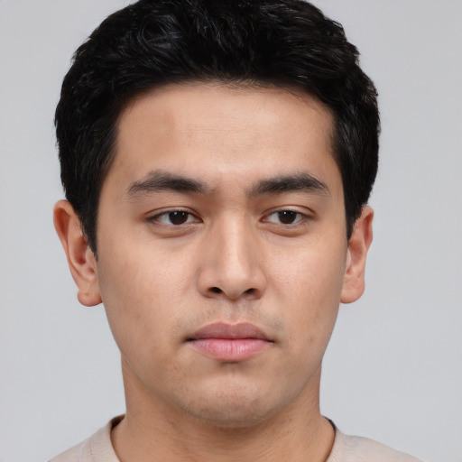 Neutral white young-adult male with short  black hair and brown eyes