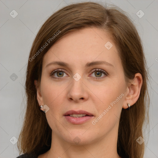 Joyful white young-adult female with long  brown hair and green eyes