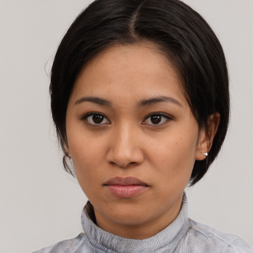 Neutral latino young-adult female with medium  black hair and brown eyes