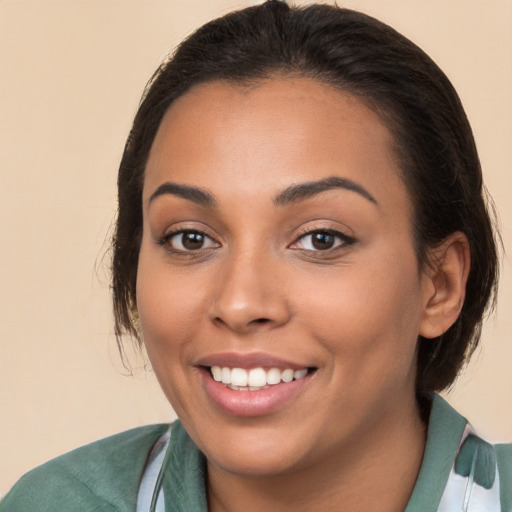 Joyful white young-adult female with medium  brown hair and brown eyes