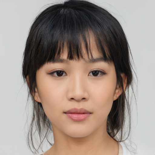Neutral asian young-adult female with medium  brown hair and brown eyes