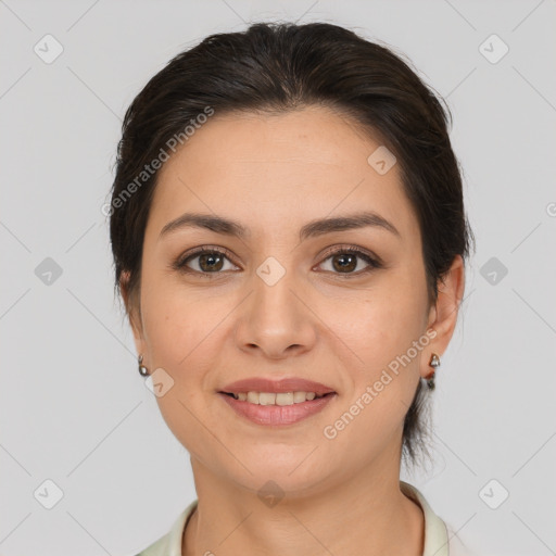 Joyful white young-adult female with medium  brown hair and brown eyes