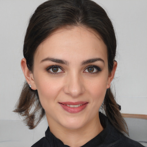 Joyful white young-adult female with medium  brown hair and brown eyes