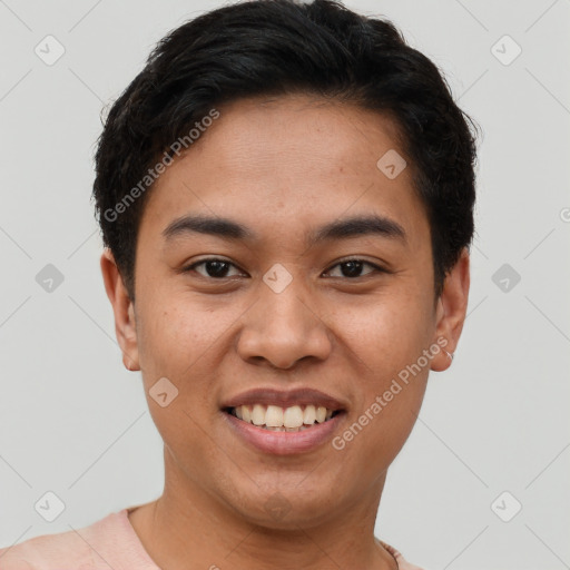 Joyful latino young-adult male with short  brown hair and brown eyes