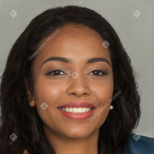 Joyful black young-adult female with long  brown hair and brown eyes