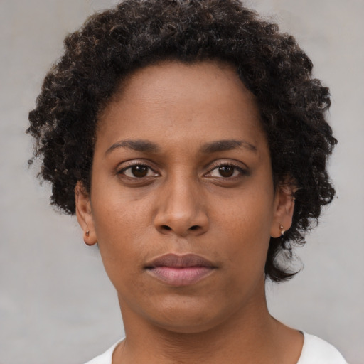 Neutral black young-adult female with short  brown hair and brown eyes