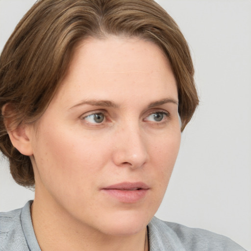 Neutral white young-adult female with medium  brown hair and grey eyes