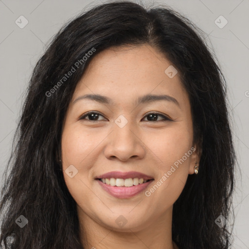 Joyful asian young-adult female with long  brown hair and brown eyes