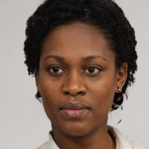 Neutral black young-adult female with short  black hair and brown eyes