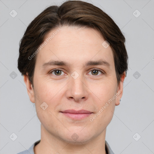 Joyful white young-adult male with short  brown hair and brown eyes