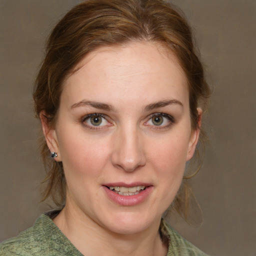 Joyful white young-adult female with medium  brown hair and green eyes